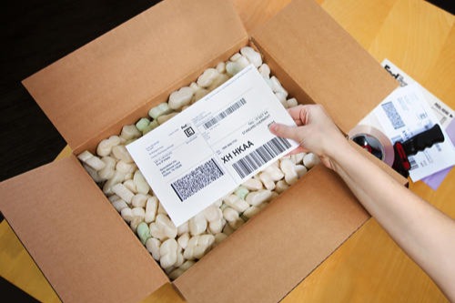 Box, packing peanuts and label