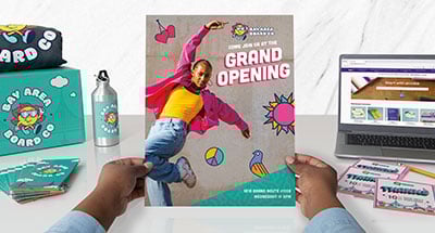 A person holding printed material